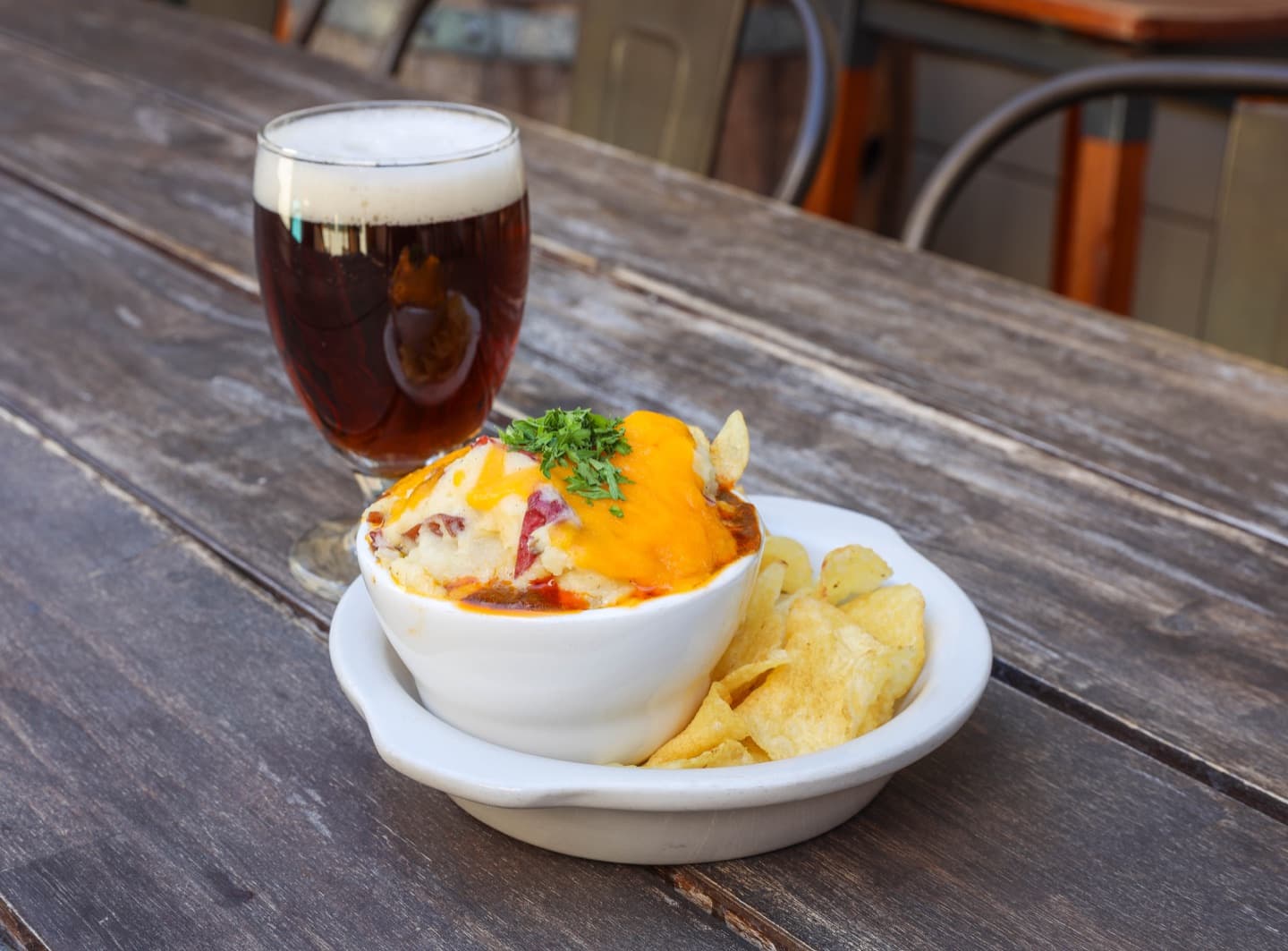 Baked pub dish topped with mashed potatoes and cheddar