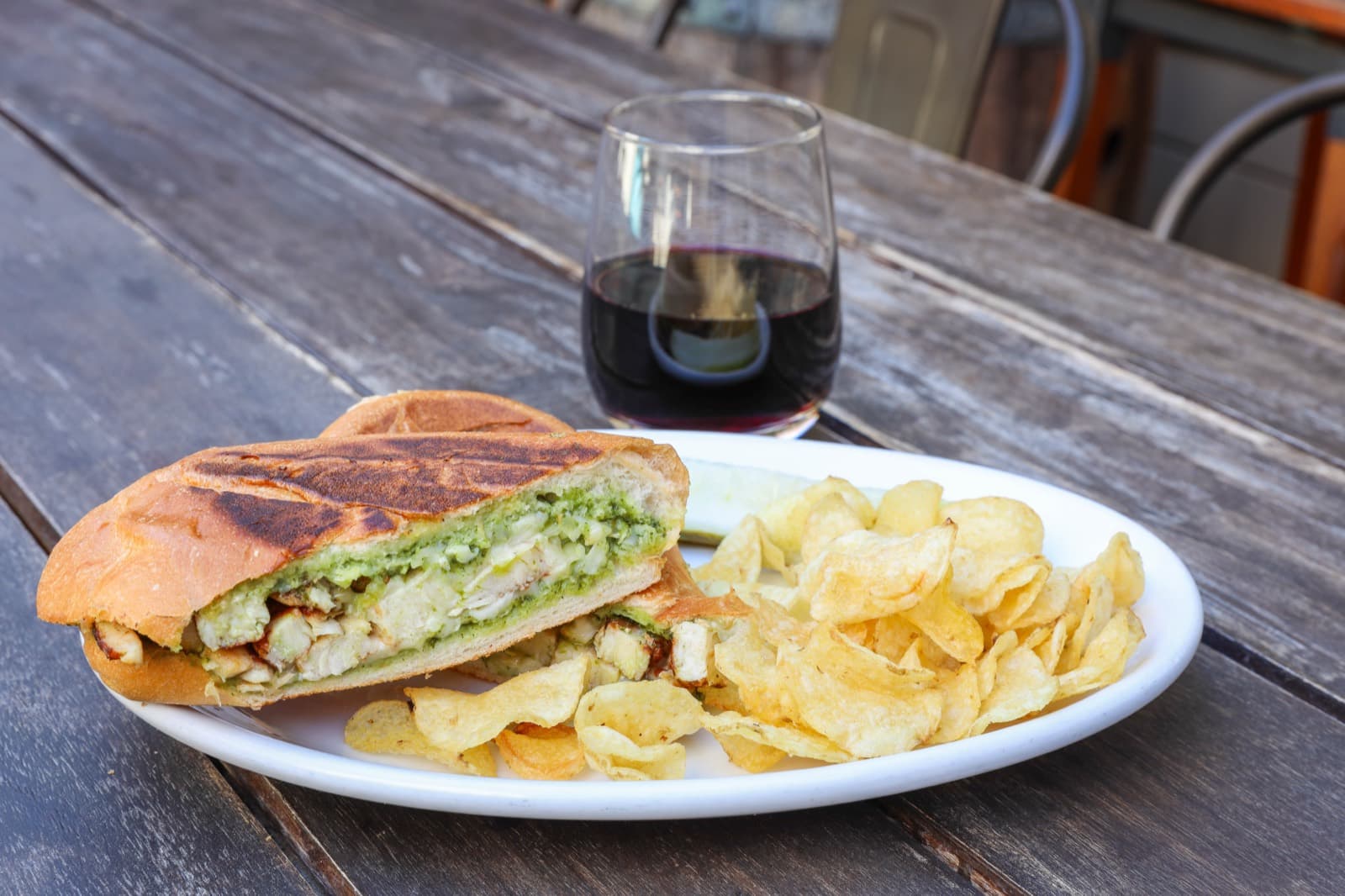 Grilled chicken pesto panini served with chips